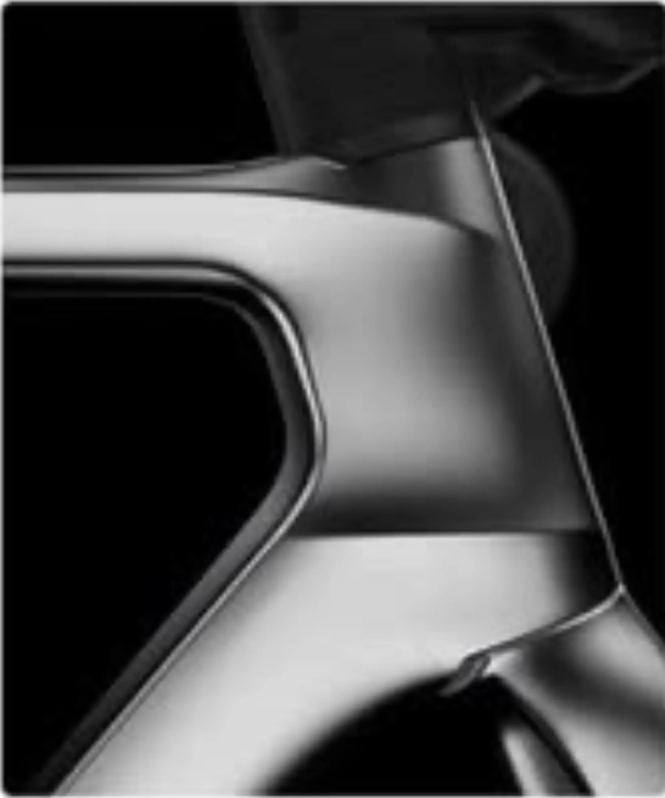 Close study of a polished black and chrome bicycle frame